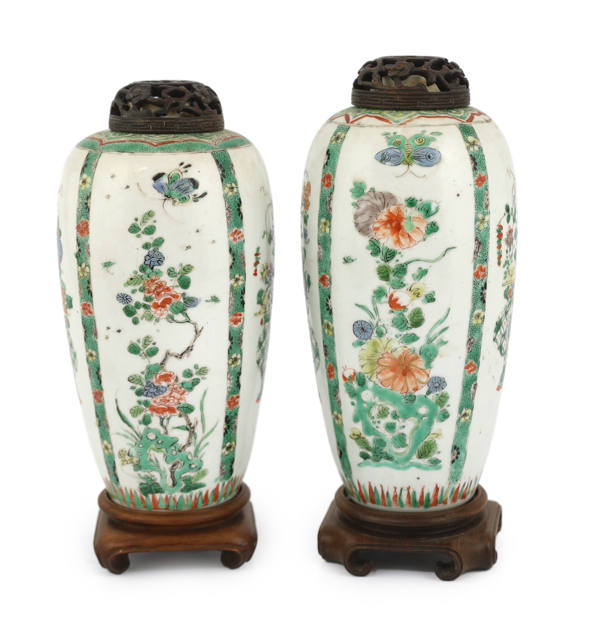 A near pair of Chinese famille verte jars, Kangxi period, on wood plinths, blue enamels repainted
